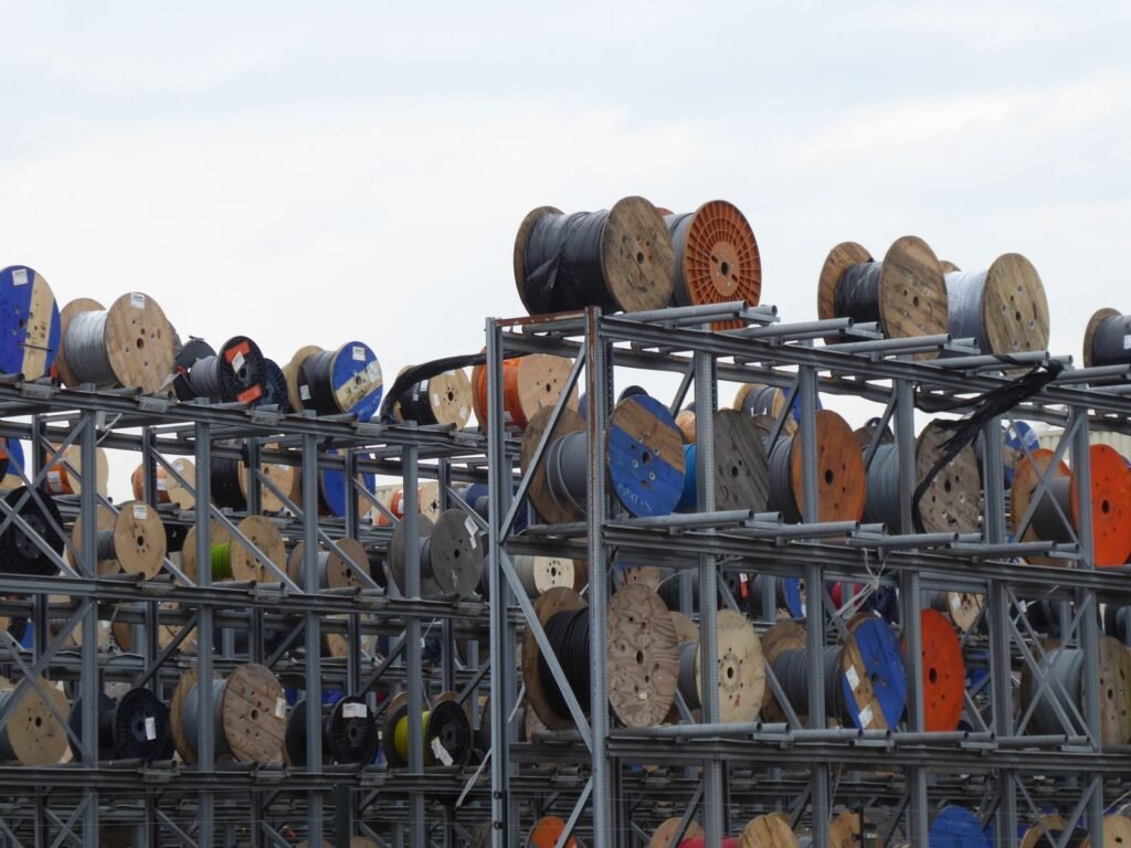 Industrial cable reels stacked outdoors