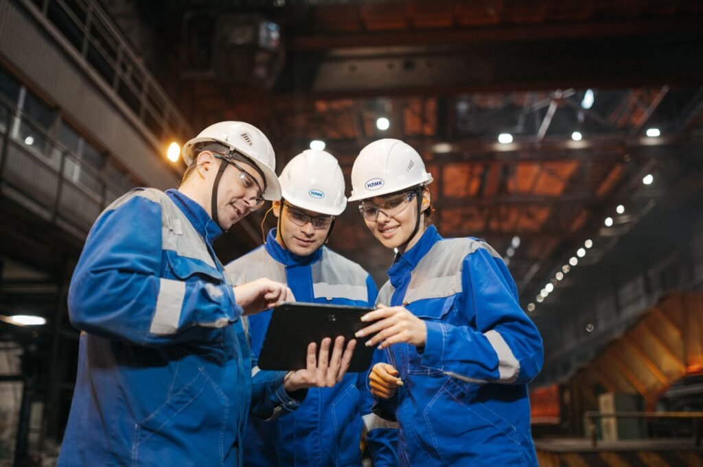 Engineers reviewing a project on a tablet in a factory