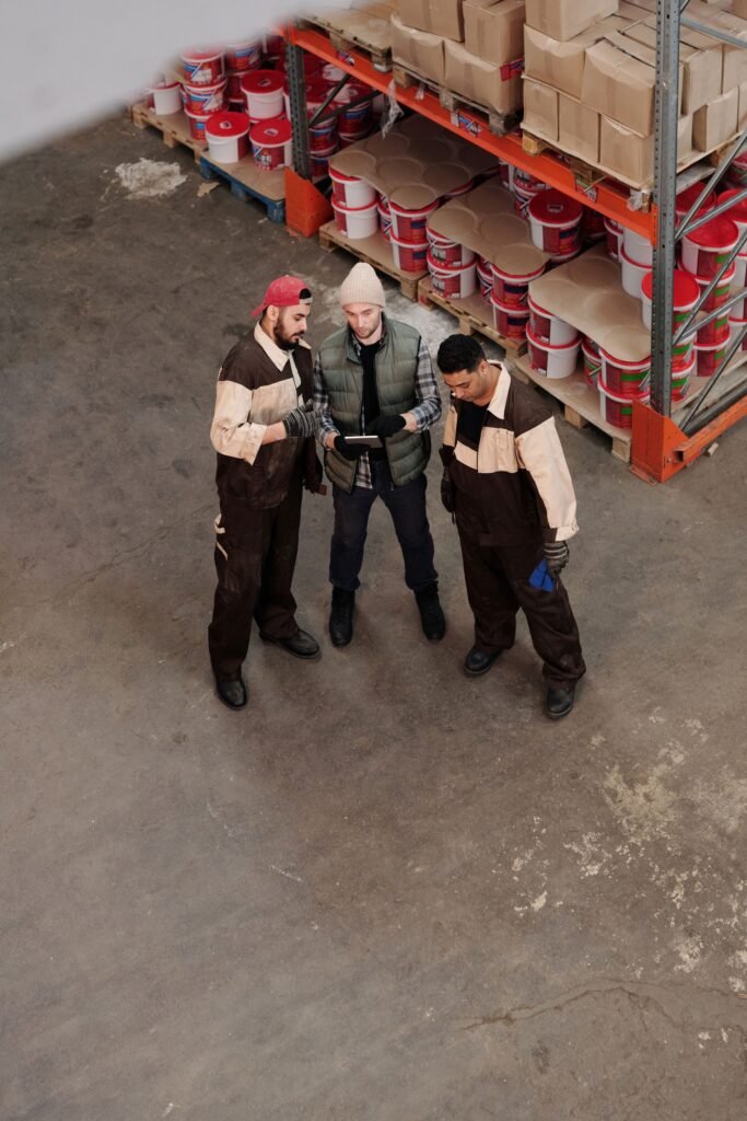 Team discussing logistics in a warehouse